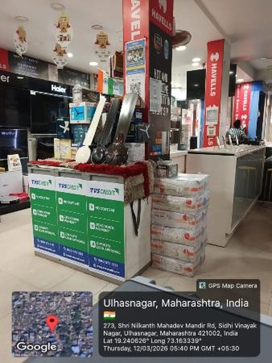 TVS Credit counter branding at an electronics store in Ulhasnagar, Maharashtra, geo-tagged